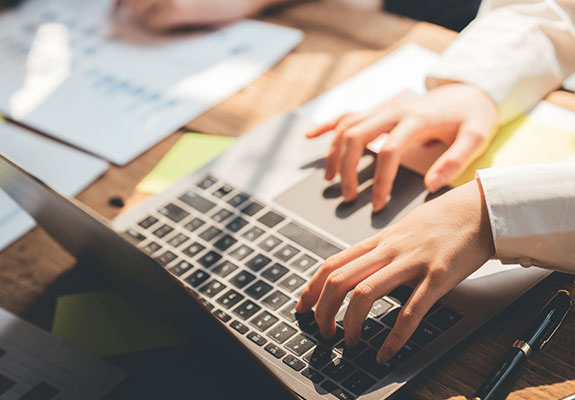 Person typing on a computer